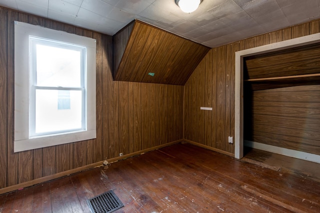 610 2nd St SW, Wadena, MN 56482 - additional living space featuring hardwood / wood-style flooring, lofted ceiling, and wooden walls