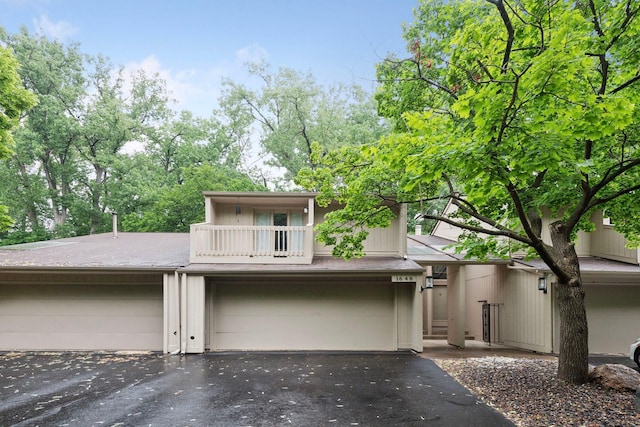 1648 Comstock Ln N, Plymouth, MN 55447 - view of front of property with driveway, a balcony, and a garage