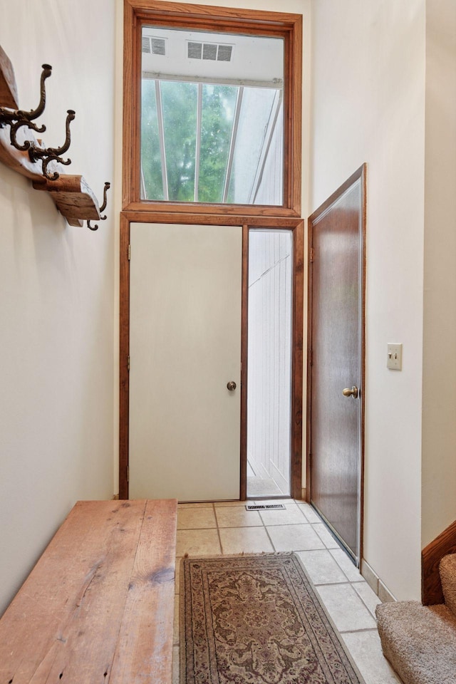 1648 Comstock Ln N, Plymouth, MN 55447 - entryway featuring light tile patterned flooring