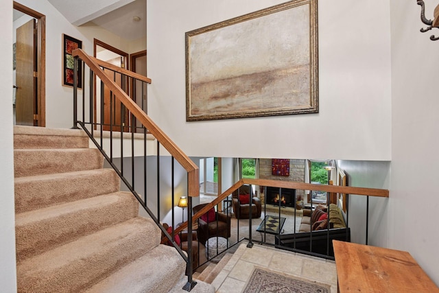 1648 Comstock Ln N, Plymouth, MN 55447 - stairway featuring a warm lit fireplace and stone finish flooring