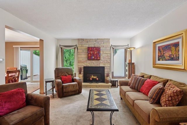 1648 Comstock Ln N, Plymouth, MN 55447 - living area featuring light carpet, a stone fireplace, and a textured ceiling