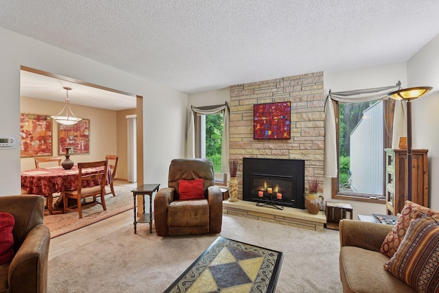 1648 Comstock Ln N, Plymouth, MN 55447 - carpeted living room with a stone fireplace and a textured ceiling