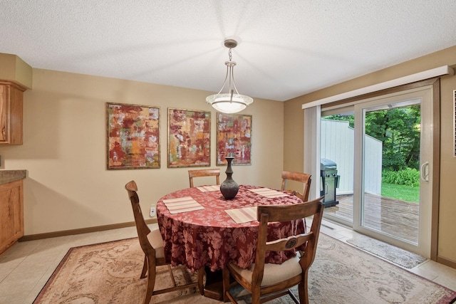 1648 Comstock Ln N, Plymouth, MN 55447 - dining area featuring a textured ceiling and light tile patterned floors