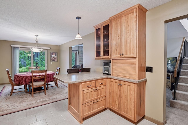 1648 Comstock Ln N, Plymouth, MN 55447 - kitchen featuring a peninsula, glass insert cabinets, light countertops, hanging light fixtures, and light tile patterned floors
