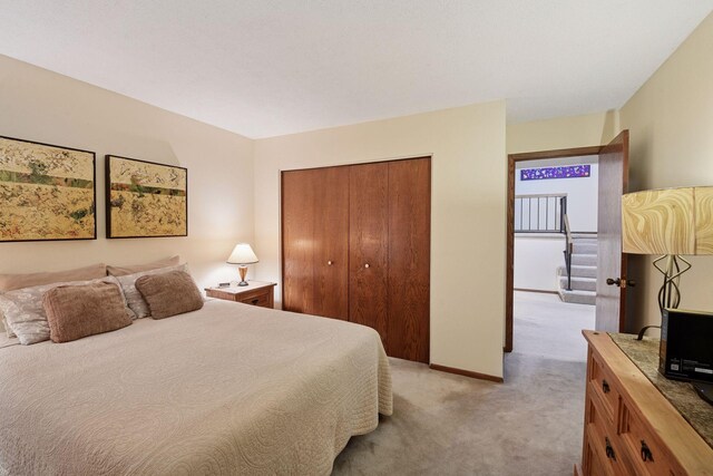 1648 Comstock Ln N, Plymouth, MN 55447 - bedroom with light colored carpet and a closet