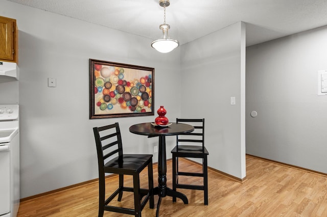 4 Pine Tree Dr Unit 218, Arden Hills, MN 55112 - dining room featuring light wood-style floors and baseboards