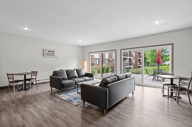 4 Pine Tree Dr Unit 218, Arden Hills, MN 55112 - living area with a textured ceiling, wood finished floors, recessed lighting, and a wall unit AC