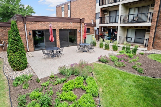 4 Pine Tree Dr Unit 218, Arden Hills, MN 55112 - rear view of property featuring a patio area, brick siding, and an AC wall unit