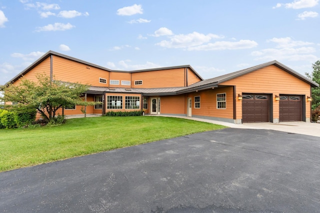 360 Karens Way NW, Alexandria, MN 56308 - contemporary home featuring driveway, an attached garage, and a front lawn