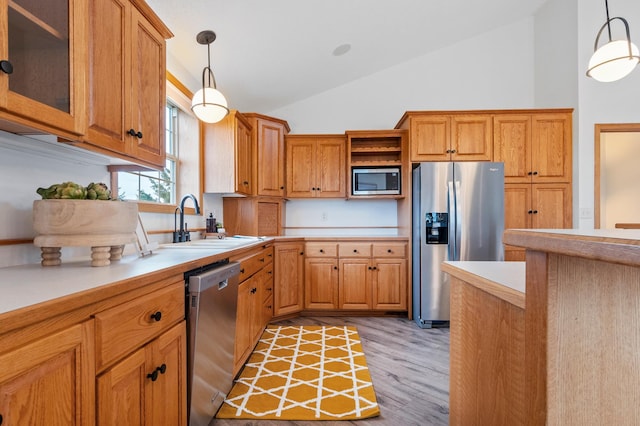 360 Karens Way NW, Alexandria, MN 56308 - kitchen with stainless steel appliances, open shelves, light wood-style flooring, light countertops, and pendant lighting