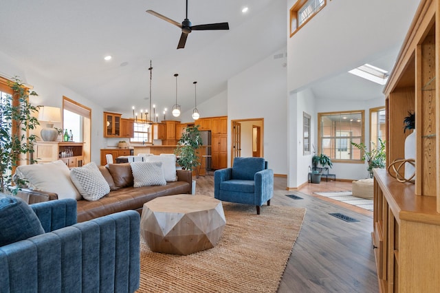 360 Karens Way NW, Alexandria, MN 56308 - living room featuring ceiling fan, light wood-style flooring, recessed lighting, high vaulted ceiling, and a chandelier