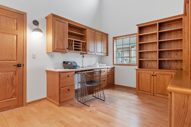 360 Karens Way NW, Alexandria, MN 56308 - office with light wood-type flooring, built in study area, and a high ceiling