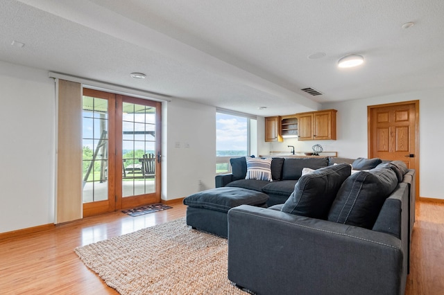 360 Karens Way NW, Alexandria, MN 56308 - living area with light wood-style floors and a textured ceiling