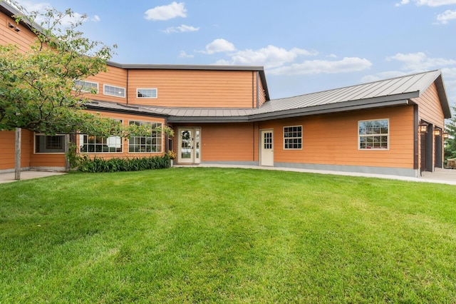 360 Karens Way NW, Alexandria, MN 56308 - back of house featuring a metal roof, a standing seam roof, and a yard