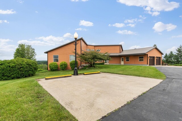 360 Karens Way NW, Alexandria, MN 56308 - view of property exterior with a lawn and a metal roof