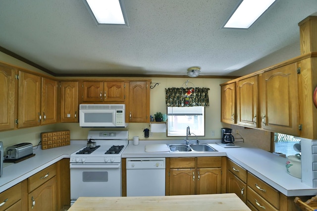 30348 422nd Ln, Aitkin, MN 56431 - kitchen featuring white appliances, light countertops, and brown cabinetry