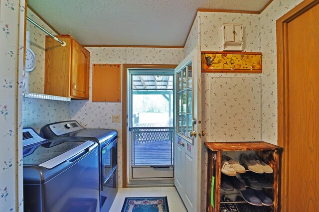 30348 422nd Ln, Aitkin, MN 56431 - laundry area with wallpapered walls, cabinet space, washer and clothes dryer, a textured ceiling, and ornamental molding