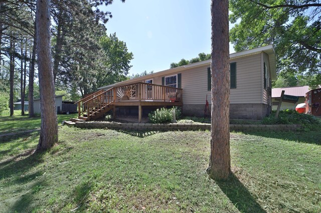 30348 422nd Ln, Aitkin, MN 56431 - rear view of property with a wooden deck, a yard, and stairs