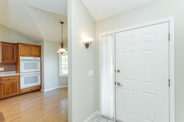 1954 Topaz Pointe Ln SW, Rochester, MN 55902 - foyer featuring light wood finished floors and vaulted ceiling