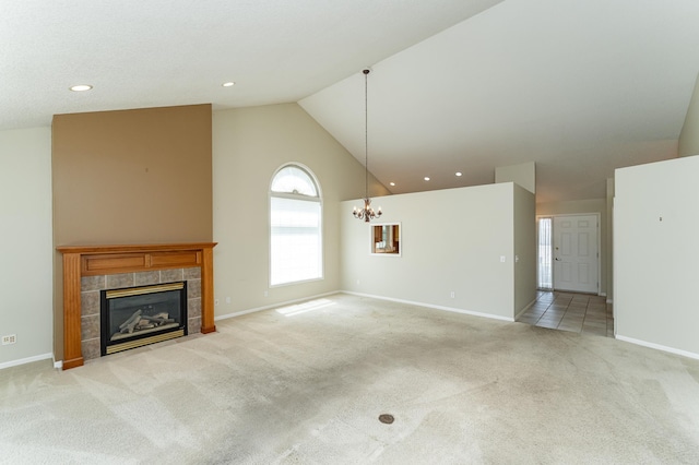 1954 Topaz Pointe Ln SW, Rochester, MN 55902 - unfurnished living room with light colored carpet, a chandelier, a fireplace, high vaulted ceiling, and recessed lighting