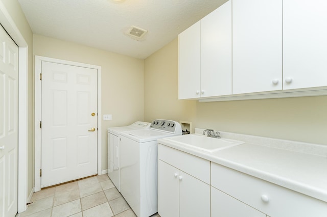 1954 Topaz Pointe Ln SW, Rochester, MN 55902 - laundry room featuring cabinet space, washing machine and clothes dryer, and light tile patterned floors