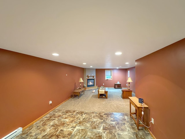 3033 Redwood Ave, Slayton, MN 56172 - carpeted living area featuring a baseboard radiator, recessed lighting, and a glass covered fireplace