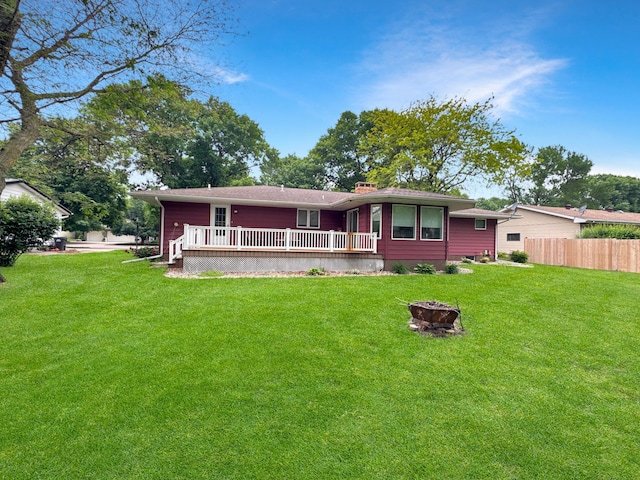 3033 Redwood Ave, Slayton, MN 56172 - view of front facade featuring a fire pit and a wooden deck