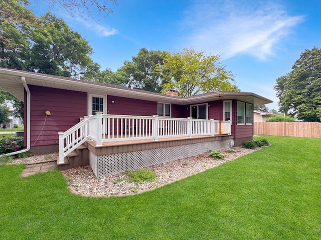3033 Redwood Ave, Slayton, MN 56172 - rear view of house with a wooden deck and a chimney