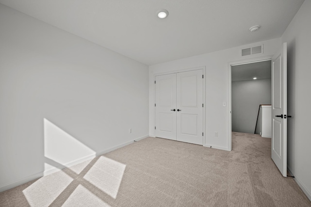 TBB Trinity, Shakopee, MN 55379 - unfurnished bedroom featuring carpet floors, a closet, and recessed lighting