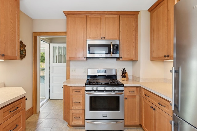 275 Pascal St S, Saint Paul, MN 55105 - kitchen featuring stainless steel appliances, light countertops, and light tile patterned flooring