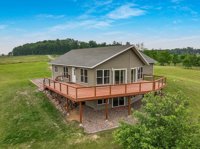 615 18th St, Prairie Lake Twp, WI 54728 - back of house with a deck, a yard, and a shingled roof