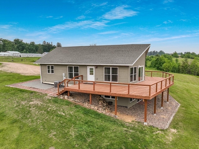 615 18th St, Prairie Lake Twp, WI 54728 - rear view of house with a deck and a lawn