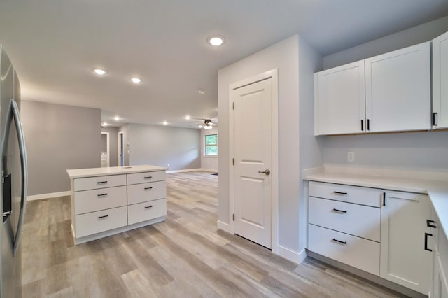 14729 Wildflower Dr, Baxter, MN 56425 - kitchen featuring ceiling fan, light wood finished floors, white cabinets, stainless steel fridge with ice dispenser, and recessed lighting