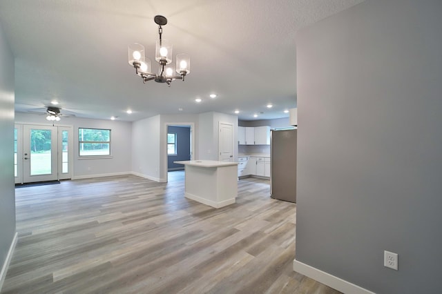 14729 Wildflower Dr, Baxter, MN 56425 - unfurnished living room featuring recessed lighting, a ceiling fan, light wood-style floors, and a chandelier