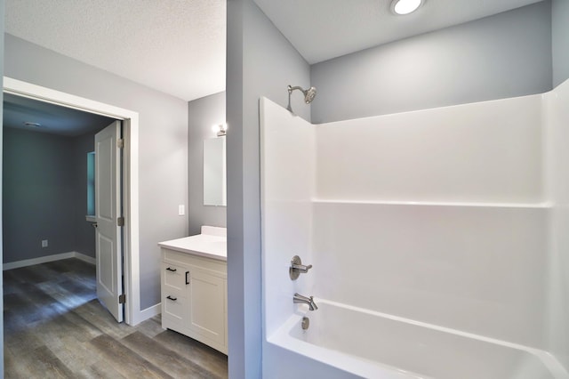 14729 Wildflower Dr, Baxter, MN 56425 - bathroom with bathing tub / shower combination, vanity, and wood finished floors