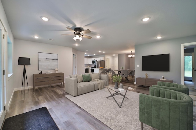 14729 Wildflower Dr, Baxter, MN 56425 - living area with a chandelier, wood finished floors, ceiling fan, and recessed lighting