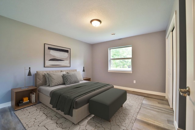 14729 Wildflower Dr, Baxter, MN 56425 - bedroom featuring light wood-style floors and a closet