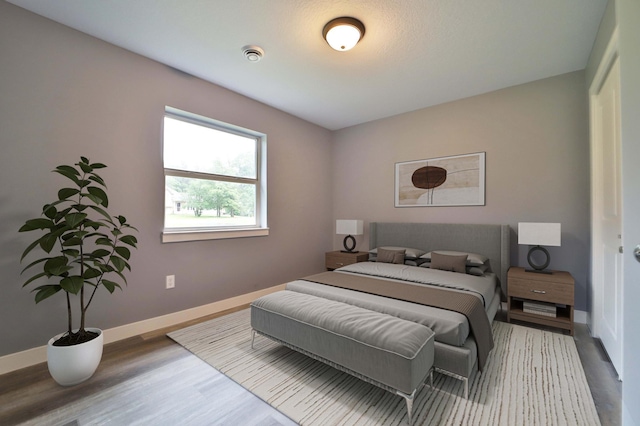 14729 Wildflower Dr, Baxter, MN 56425 - bedroom with baseboards and wood finished floors