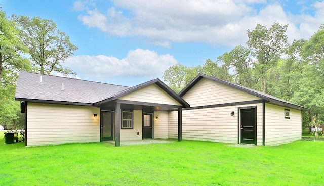 14729 Wildflower Dr, Baxter, MN 56425 - rear view of property featuring a yard, a patio, and a shingled roof