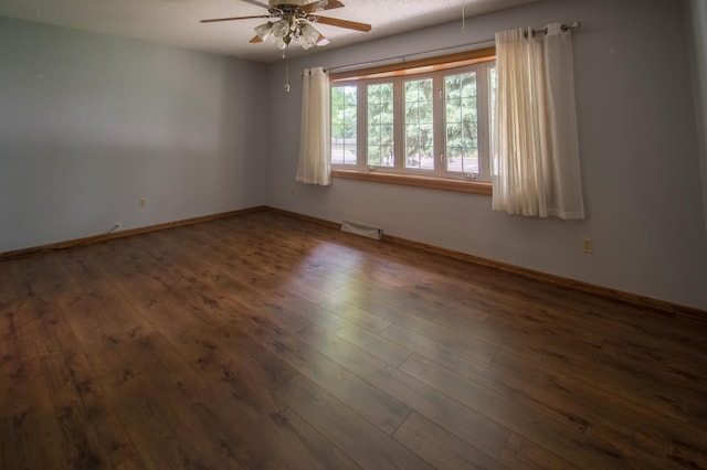 12423 93rd Ave N, Maple Grove, MN 55369 - empty room with a ceiling fan and wood finished floors