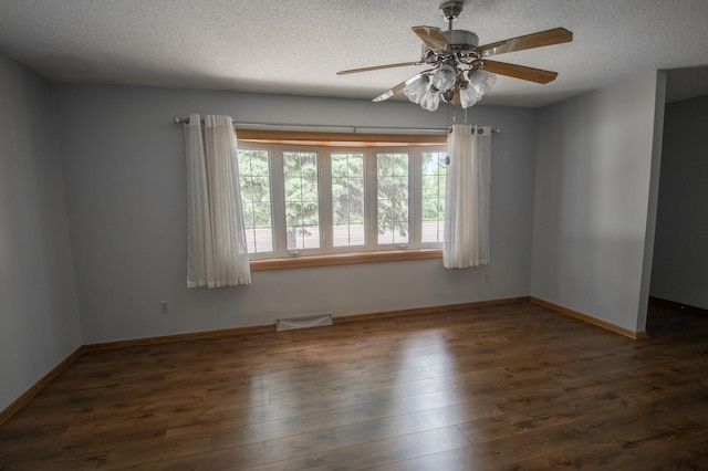 12423 93rd Ave N, Maple Grove, MN 55369 - unfurnished room featuring a textured ceiling, ceiling fan, and wood finished floors