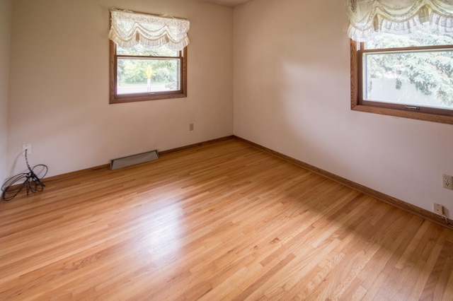 12423 93rd Ave N, Maple Grove, MN 55369 - unfurnished room with light wood-type flooring and baseboards