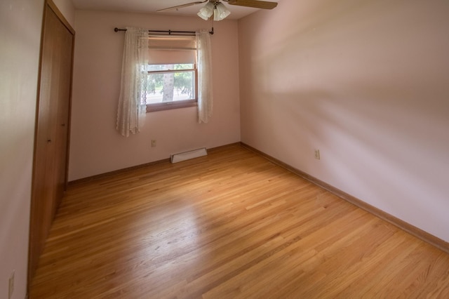 12423 93rd Ave N, Maple Grove, MN 55369 - unfurnished bedroom featuring light wood-style floors, a closet, and a ceiling fan