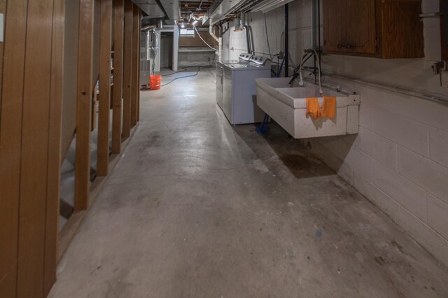 12423 93rd Ave N, Maple Grove, MN 55369 - unfinished below grade area featuring washing machine and clothes dryer, concrete block wall, and heating unit