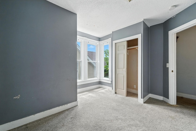 870 Clark St, Saint Paul, MN 55130 - unfurnished bedroom with carpet floors and a textured ceiling