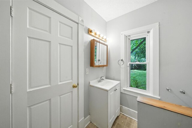 870 Clark St, Saint Paul, MN 55130 - bathroom with vanity and baseboards
