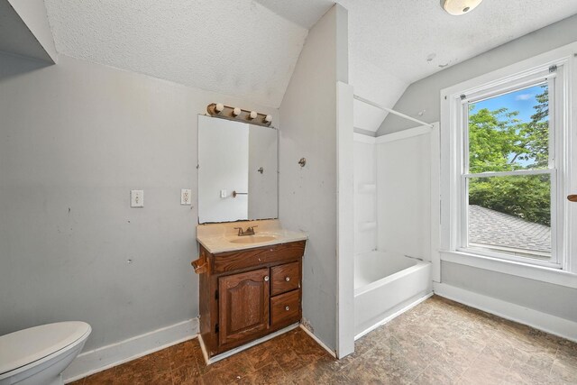 870 Clark St, Saint Paul, MN 55130 - full bathroom with a textured ceiling, vanity, vaulted ceiling, and bathtub / shower combination