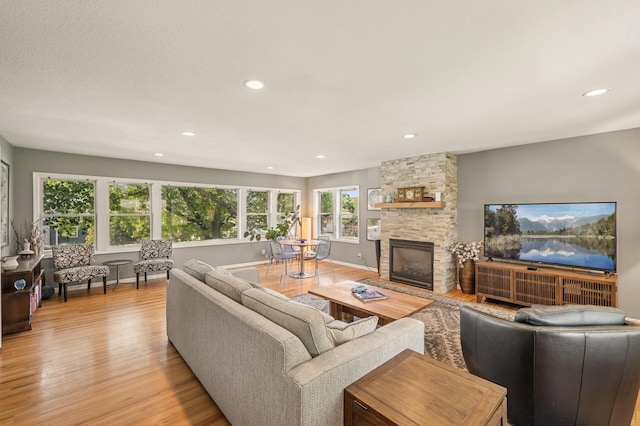 3420 Parkview Blvd, Robbinsdale, MN 55422 - living area featuring light wood-style floors, a fireplace, and recessed lighting