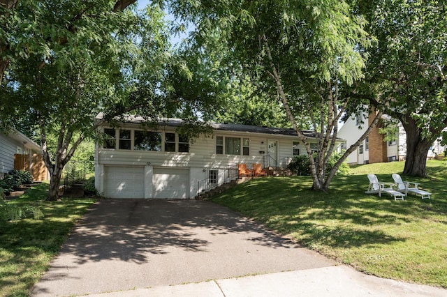 3420 Parkview Blvd, Robbinsdale, MN 55422 - view of front facade with driveway, an attached garage, and a front lawn