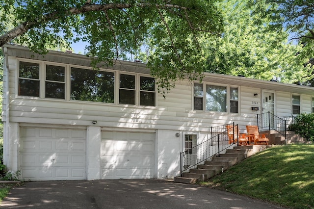 3420 Parkview Blvd, Robbinsdale, MN 55422 - view of front facade featuring an attached garage and asphalt driveway